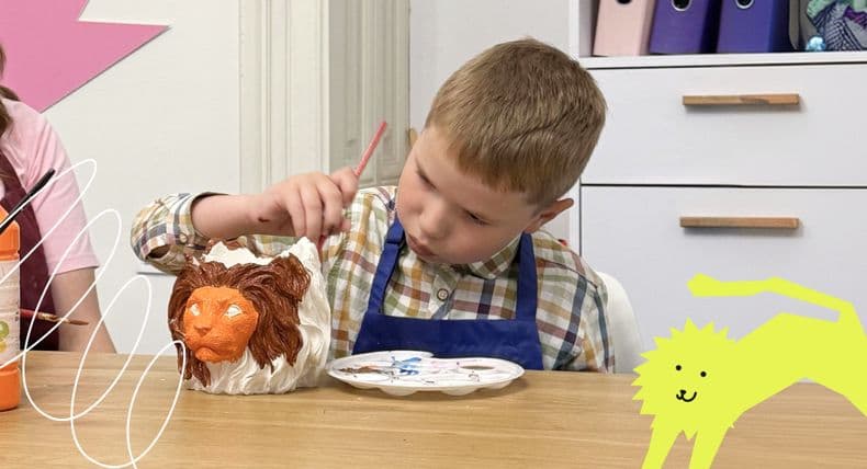 Children at LEVCHYK create lion-shaped flowerpots as gifts for hub supporters